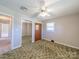Bedroom showcasing a ceiling fan and a mirrored closet at 2310 Clay St, Kannapolis, NC 28083