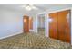 Bedroom with neutral paint, closet, and a clear view to an additional room at 2310 Clay St, Kannapolis, NC 28083