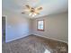 Bedroom showcasing a ceiling fan and natural light from a window with wood trim at 2310 Clay St, Kannapolis, NC 28083