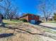 View of the brick home with a walk out basement and yard at 2310 Clay St, Kannapolis, NC 28083