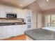 Kitchen with white cabinets, stainless steel appliances, and a spacious countertop at 2527 Ivey Church Rd, Lincolnton, NC 28092