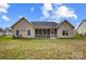 Exterior of home displaying the backyard and screened porch at 255 Dorothy Dr, China Grove, NC 28023