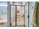 Modern bathroom features a tile shower with a pebble floor and a glass door at 255 Dorothy Dr, China Grove, NC 28023