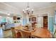 Well-lit dining room showcasing hardwood floors, decorative accents, and an open design to the adjacent living spaces at 255 Dorothy Dr, China Grove, NC 28023