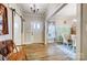 Welcoming entryway featuring hardwood floors, stylish decor, and convenient access to both dining and living areas at 255 Dorothy Dr, China Grove, NC 28023