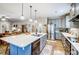 Open kitchen featuring a large island, stainless steel appliances, and seamless flow to dining and living areas at 255 Dorothy Dr, China Grove, NC 28023