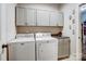 Well-equipped laundry room with modern appliances and ample storage cabinets at 255 Dorothy Dr, China Grove, NC 28023