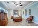 Elegantly furnished main bedroom featuring hardwood floors, soft lighting, and a cozy seating area, creating a relaxing space at 255 Dorothy Dr, China Grove, NC 28023