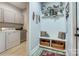 Convenient mudroom with laundry area, bench, and storage for an organized entry at 255 Dorothy Dr, China Grove, NC 28023