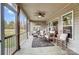 Relaxing screened porch with ceiling fan and view of backyard at 255 Dorothy Dr, China Grove, NC 28023