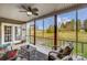 Inviting screened porch with furniture and a view of the expansive backyard at 255 Dorothy Dr, China Grove, NC 28023