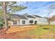 Expansive backyard showcasing a newly constructed wooden deck, offering ample space for relaxation and gatherings at 2702 Robyns Glen Dr, Charlotte, NC 28269