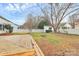 Picture of a multi-level wooden deck looking out on a fenced backyard featuring a shed, trees, and green lawn at 2702 Robyns Glen Dr, Charlotte, NC 28269