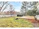 Large backyard featuring a new wooden deck and a well-maintained lawn, perfect for outdoor activities and relaxation at 2702 Robyns Glen Dr, Charlotte, NC 28269