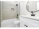 Bathroom featuring a vanity and shower-tub with light gray tiling and black fixtures at 2702 Robyns Glen Dr, Charlotte, NC 28269