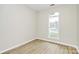 Bedroom with window and wood-look flooring at 2702 Robyns Glen Dr, Charlotte, NC 28269