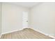 This bedroom is well lit and features wood-look flooring and crisp, clean walls at 2702 Robyns Glen Dr, Charlotte, NC 28269