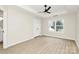 Bright bedroom with tray ceiling and view of window at 2702 Robyns Glen Dr, Charlotte, NC 28269