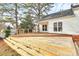 Picture of a multi-level wooden deck perfect for grilling and outdoor entertainment in the spacious backyard at 2702 Robyns Glen Dr, Charlotte, NC 28269