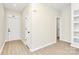 Clean, minimalist entryway with neutral walls, modern floors, a white front door and white trim at 2702 Robyns Glen Dr, Charlotte, NC 28269