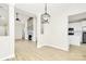 Bright living room featuring a fireplace and a view of a modern kitchen at 2702 Robyns Glen Dr, Charlotte, NC 28269