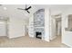 Spacious living area with sleek floors, a striking fireplace, built-in shelving, and neutral walls at 2702 Robyns Glen Dr, Charlotte, NC 28269