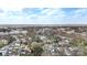 Expansive aerial view of neighborhood homes, community buildings, and treed horizon on a partly cloudy day at 312 Flint St, Charlotte, NC 28216