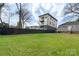 Spacious green backyard, partially fenced, with potential for landscaping at 312 Flint St, Charlotte, NC 28216