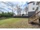 Well-maintained backyard with dark wood fence and established trees at 312 Flint St, Charlotte, NC 28216