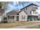 Charming home with a covered porch and neatly maintained lawn at 312 Flint St, Charlotte, NC 28216