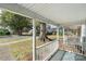 Inviting covered front porch with white railing and blue floor at 312 Flint St, Charlotte, NC 28216