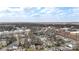 A broad aerial view shows an urban neighborhood with a mix of housing and commercial properties at 314 Flint St, Charlotte, NC 28216