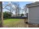 Backyard featuring green grass, mature trees, and access to a rear deck at 314 Flint St, Charlotte, NC 28216