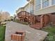 Charming backyard featuring a brick patio, wooden deck, and well-manicured lawn at 315 Drake Park Ave, Fort Mill, SC 29708
