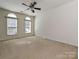 Bedroom featuring carpet flooring and windows allowing natural light to illuminate the space at 315 Drake Park Ave, Fort Mill, SC 29708
