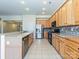 Updated kitchen with tile floors, stainless steel appliances, and granite counters at 315 Drake Park Ave, Fort Mill, SC 29708