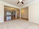 Open-concept living area with hardwood floors, white columns, and a view into the dining area, ideal for entertaining at 315 Drake Park Ave, Fort Mill, SC 29708