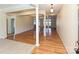 Bright living room with hardwood floors and white columns, showcasing a spacious and open-concept design at 315 Drake Park Ave, Fort Mill, SC 29708