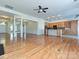 Spacious living room featuring hardwood floors, kitchen view and large windows at 315 Drake Park Ave, Fort Mill, SC 29708