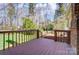 View from deck showing lush backyard with seating at 3200 Tallia Ct, Charlotte, NC 28269