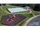 Aerial view showcasing the community pool and playground, nestled in a well-manicured setting at 3449 Southern Red Oak Ln, Gastonia, NC 28056