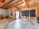 Unfinished basement space with sliding door access to the outdoors at 3449 Southern Red Oak Ln, Gastonia, NC 28056