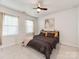 Cozy bedroom featuring a ceiling fan, neutral carpet, and soft window lighting at 3449 Southern Red Oak Ln, Gastonia, NC 28056