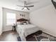 Bedroom featuring a modern ceiling fan, hardwood floors, and natural light at 3449 Southern Red Oak Ln, Gastonia, NC 28056