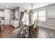 Dining room with hardwood floors, large windows, and sliding glass doors to the outside at 3449 Southern Red Oak Ln, Gastonia, NC 28056