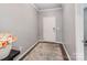 Inviting entryway featuring neutral walls, modern lighting, and a stylish rug, showcasing a welcoming atmosphere at 3449 Southern Red Oak Ln, Gastonia, NC 28056