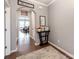Entryway featuring dark wood floors, gray walls, and arched doorways, creating a warm welcome at 3449 Southern Red Oak Ln, Gastonia, NC 28056