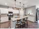 Bright kitchen featuring white cabinetry, stainless steel appliances, and a large center island with seating at 3449 Southern Red Oak Ln, Gastonia, NC 28056