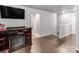 A bonus living room featuring an electric fireplace, hardwood floors, and neutral paint at 3449 Southern Red Oak Ln, Gastonia, NC 28056
