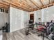 Another view of a finished basement with a red computer chair, a desk, and a doorway at 3449 Southern Red Oak Ln, Gastonia, NC 28056